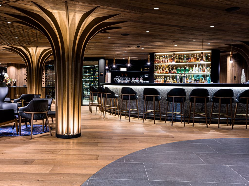 Bar area of the Hotel Granbaita Dolomites furnished with Trench barstools